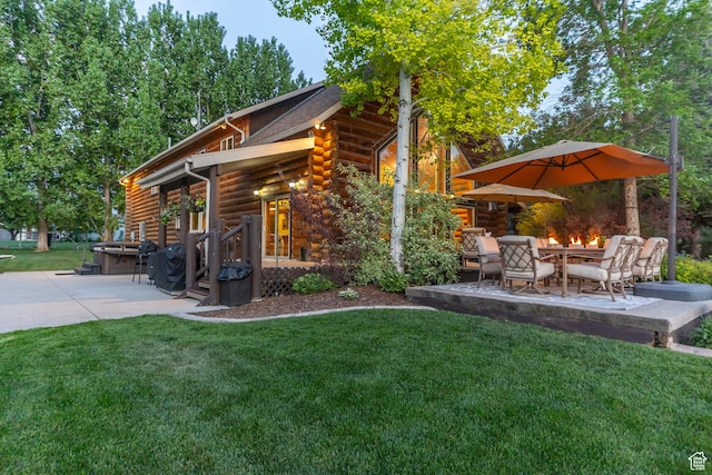 3383 Wild Mare Way, Heber City, UT 84032 - view of home's exterior featuring a patio area, log siding, and a yard