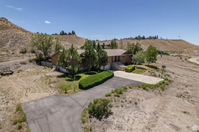 2317 N Hillside Dr, Wellington, UT 84542 - view of front of home featuring a mountain view and stucco siding