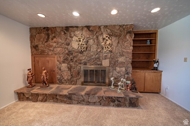 2317 N Hillside Dr, Wellington, UT 84542 - unfurnished living room featuring baseboards, a stone fireplace, and carpet floors
