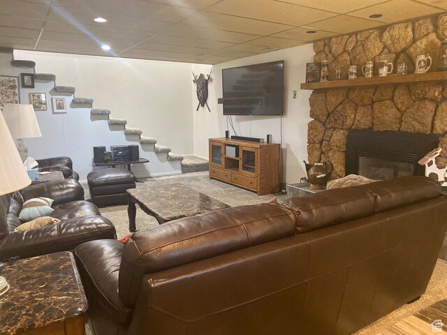 2317 N Hillside Dr, Wellington, UT 84542 - living area with stairway, a stone fireplace, and carpet