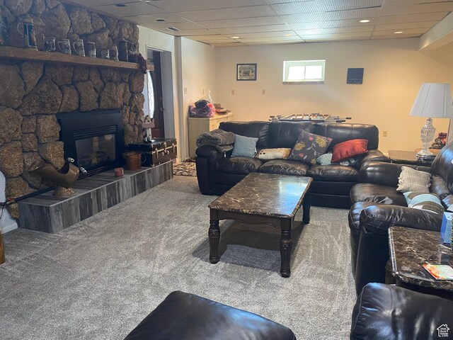 2317 N Hillside Dr, Wellington, UT 84542 - carpeted living area featuring a paneled ceiling and a stone fireplace