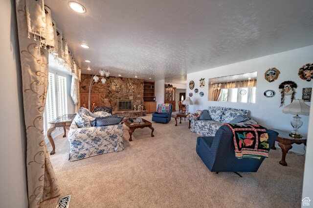 2317 N Hillside Dr, Wellington, UT 84542 - living area featuring a fireplace, carpet flooring, a textured ceiling, and recessed lighting