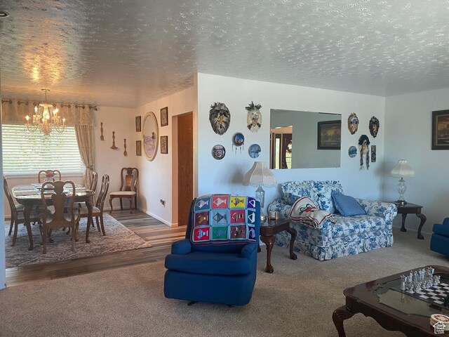 2317 N Hillside Dr, Wellington, UT 84542 - living area with a chandelier, carpet floors, a textured ceiling, and wood finished floors