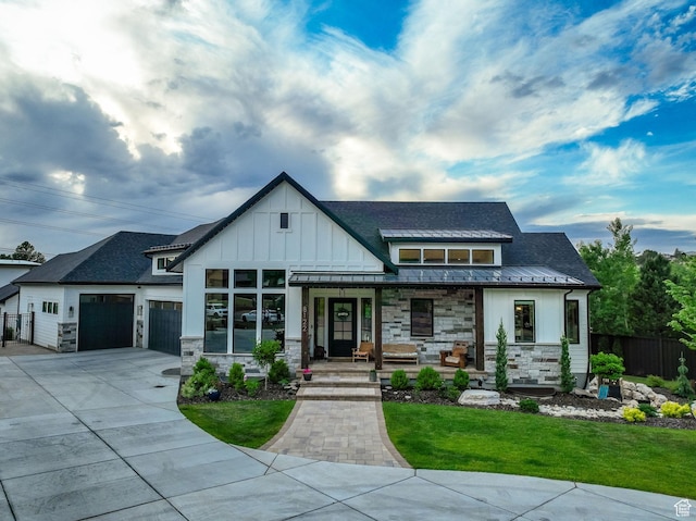 8122 S Willow Creek Cv, Cottonwood Heights, UT 84093 - view of front facade featuring a garage, a front yard, and covered porch