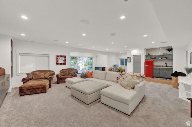8122 S Willow Creek Cv, Cottonwood Heights, UT 84093 - living room with light colored carpet and wet bar