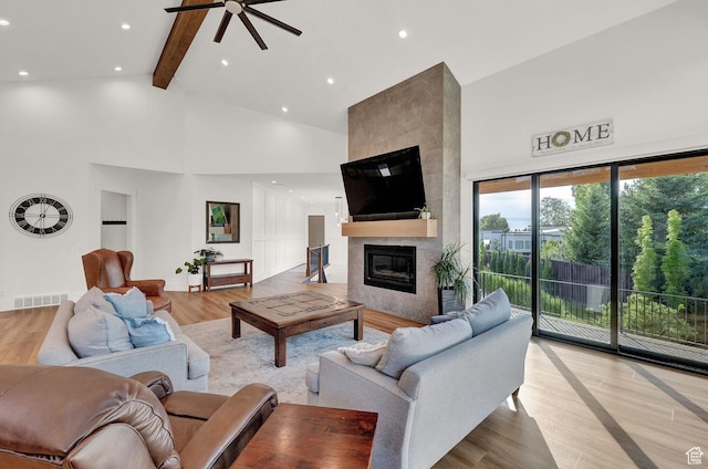 8122 S Willow Creek Cv, Cottonwood Heights, UT 84093 - living room with a fireplace, light hardwood / wood-style floors, high vaulted ceiling, and beam ceiling