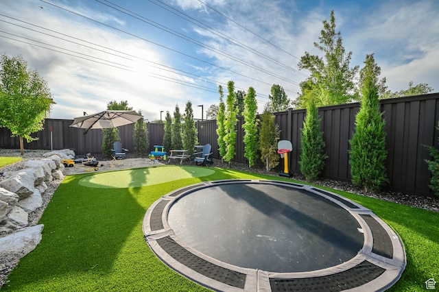 8122 S Willow Creek Cv, Cottonwood Heights, UT 84093 - view of yard with a trampoline