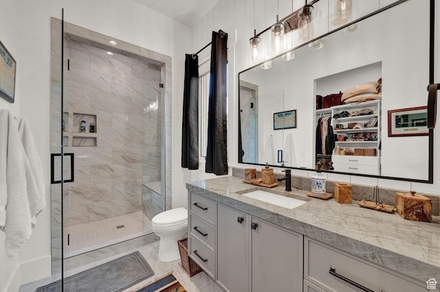 8122 S Willow Creek Cv, Cottonwood Heights, UT 84093 - bathroom with walk in shower, vanity, and toilet