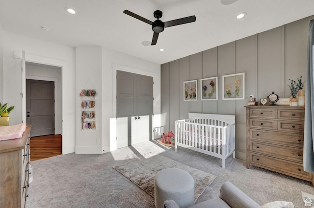 8122 S Willow Creek Cv, Cottonwood Heights, UT 84093 - bedroom with a nursery area, light carpet, and ceiling fan