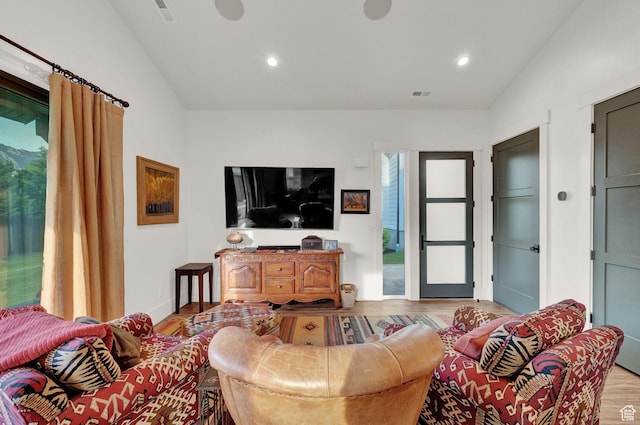 8122 S Willow Creek Cv, Cottonwood Heights, UT 84093 - living room with vaulted ceiling and light wood-type flooring