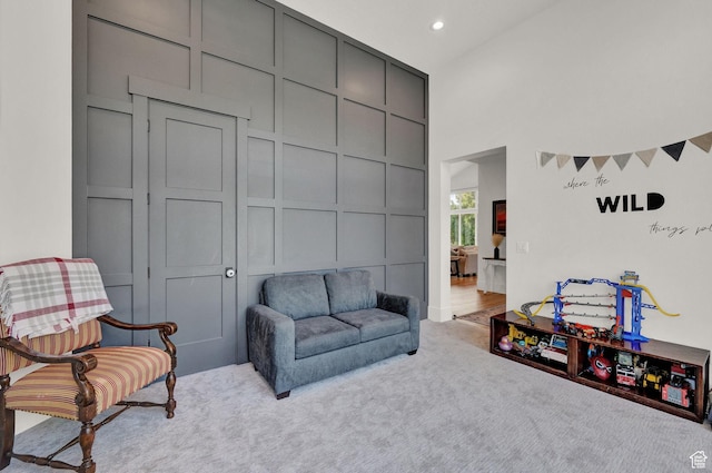 8122 S Willow Creek Cv, Cottonwood Heights, UT 84093 - living area with a towering ceiling and light carpet