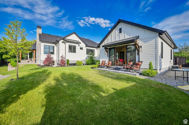 8122 S Willow Creek Cv, Cottonwood Heights, UT 84093 - rear view of house with a patio area and a lawn