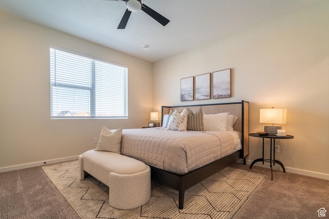 bedroom with ceiling fan and light colored carpet