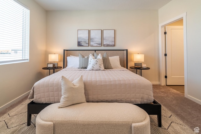 carpeted bedroom with multiple windows