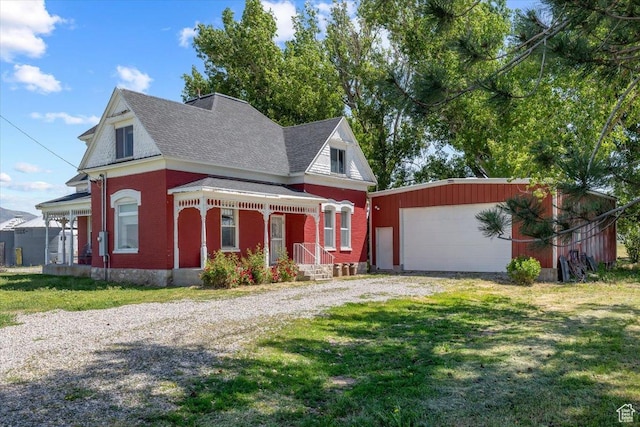 view of front of property with a garage and a front lawn