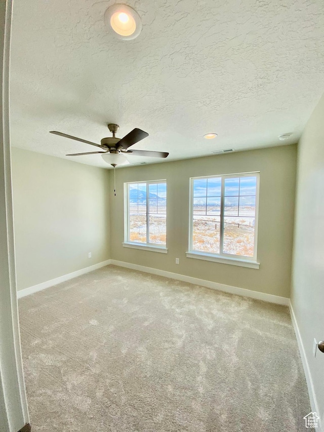 1688 N Centerpoint Ln, Salem, UT 84653 - carpeted spare room featuring baseboards, a textured ceiling, and a ceiling fan