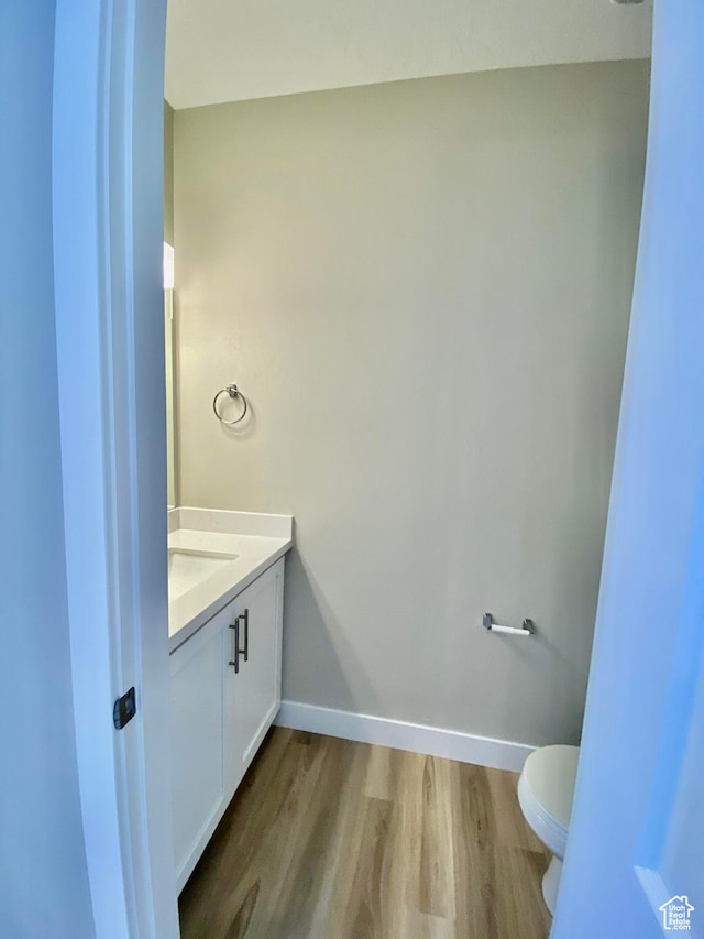 1688 N Centerpoint Ln, Salem, UT 84653 - bathroom with toilet, wood finished floors, vanity, and baseboards