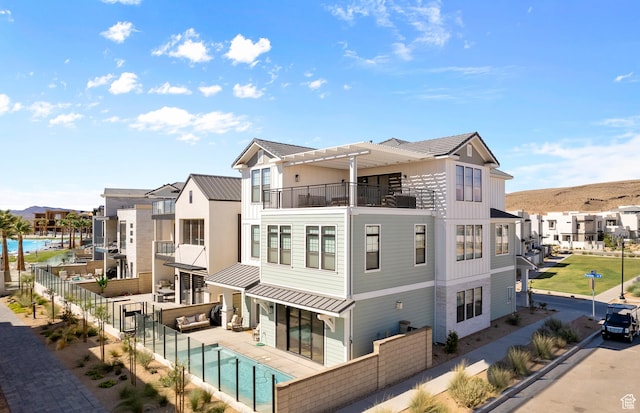 5466 S Persian Ln, St George, UT 84790 - back of property with a fenced in pool and a balcony