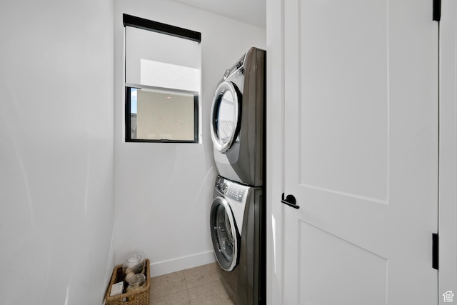 5466 S Persian Ln, St George, UT 84790 - laundry room with light tile patterned floors and stacked washer and dryer