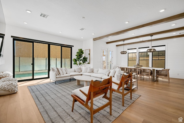 5466 S Persian Ln, St George, UT 84790 - living room featuring beamed ceiling, french doors, light wood-type flooring, and plenty of natural light