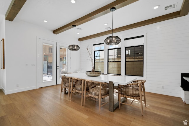 5466 S Persian Ln, St George, UT 84790 - dining room with wood walls, beam ceiling, and light hardwood / wood-style flooring
