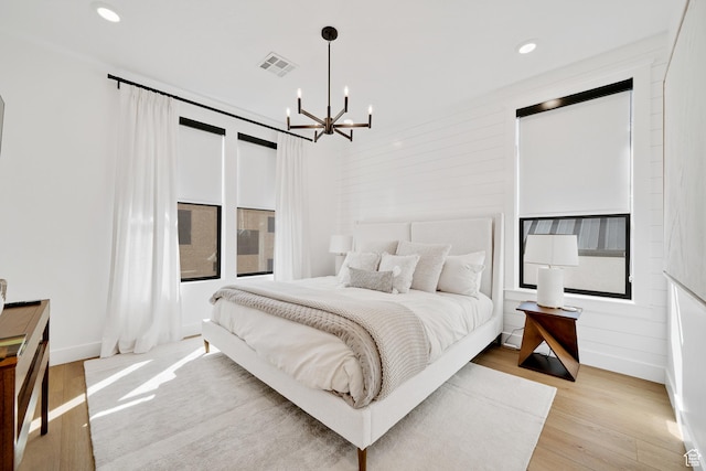 5466 S Persian Ln, St George, UT 84790 - bedroom featuring a chandelier and light hardwood / wood-style floors