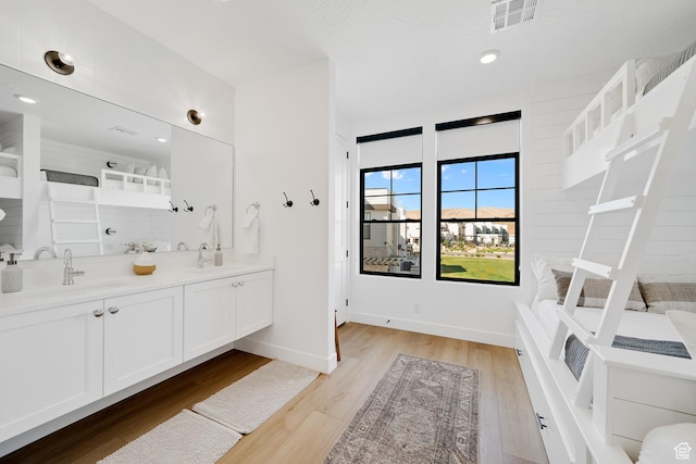 5466 S Persian Ln, St George, UT 84790 - bathroom with a shower, wood-type flooring, and vanity