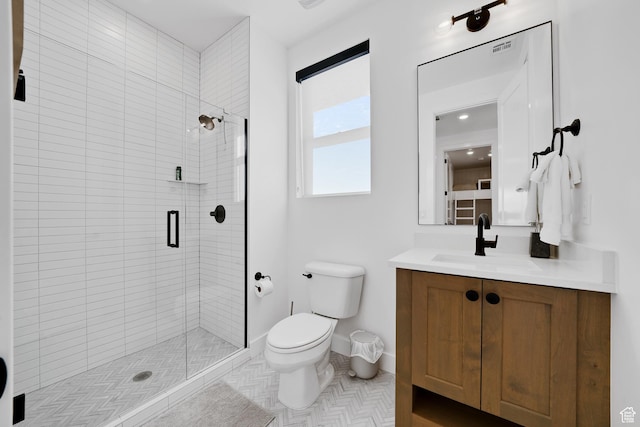 5466 S Persian Ln, St George, UT 84790 - bathroom featuring tile patterned flooring, vanity, toilet, and a shower with door