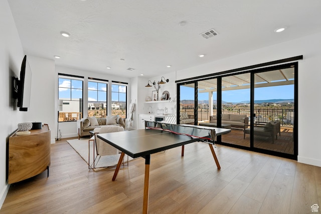 5466 S Persian Ln, St George, UT 84790 - rec room featuring a mountain view and light hardwood / wood-style flooring