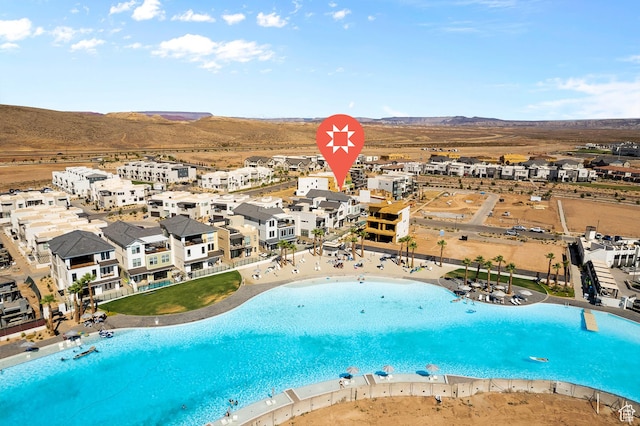 5466 S Persian Ln, St George, UT 84790 - view of swimming pool featuring a water view and a view of the beach
