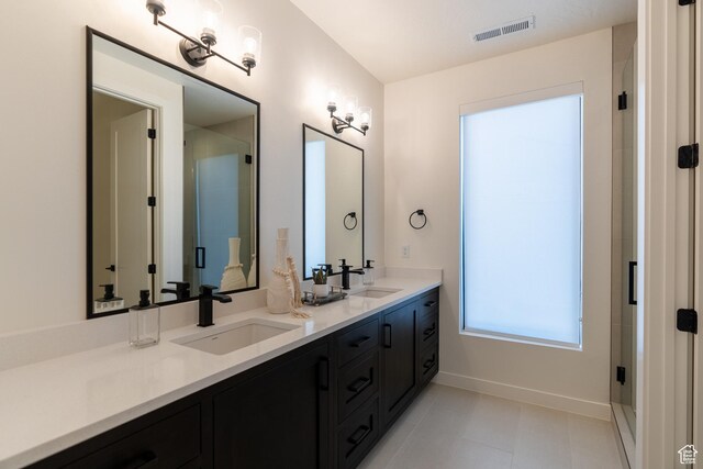 5355 S Cyan Ln, St George, UT 84790 - bathroom with tile patterned flooring, vanity, and walk in shower