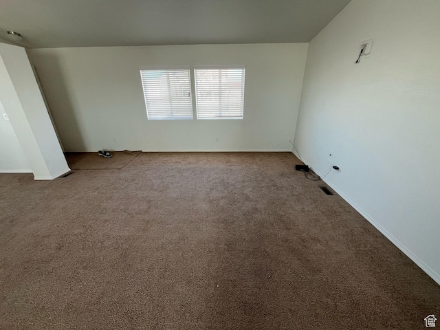 carpeted empty room with visible vents