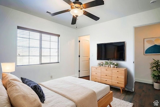 bedroom featuring dark hardwood / wood-style floors and ceiling fan