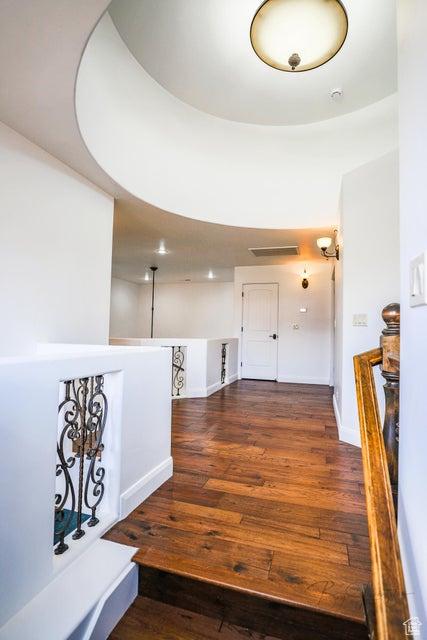 hall with dark hardwood / wood-style flooring