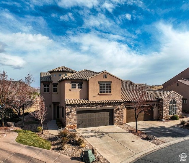 mediterranean / spanish-style house featuring a garage