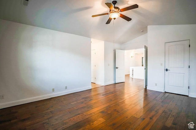 interior space featuring dark hardwood / wood-style flooring and vaulted ceiling