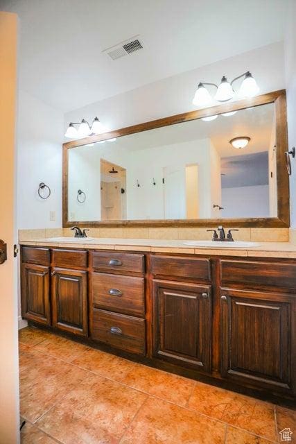 bathroom with vanity and tile patterned flooring