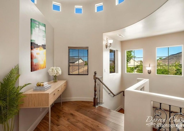 hall with hardwood / wood-style flooring