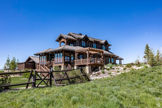 10454 E Forest Creek Rd, Kamas, UT 84036 - rear view of property featuring log exterior, a wooden deck, and fence