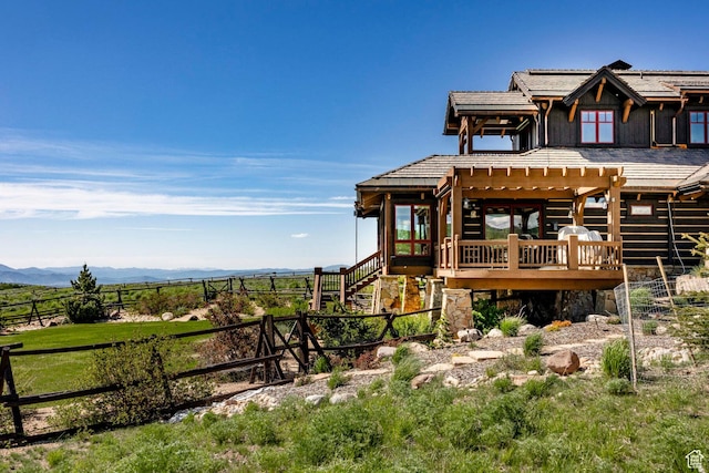 10454 E Forest Creek Rd, Kamas, UT 84036 - exterior space with a deck with mountain view, a rural view, stairs, a tiled roof, and fence
