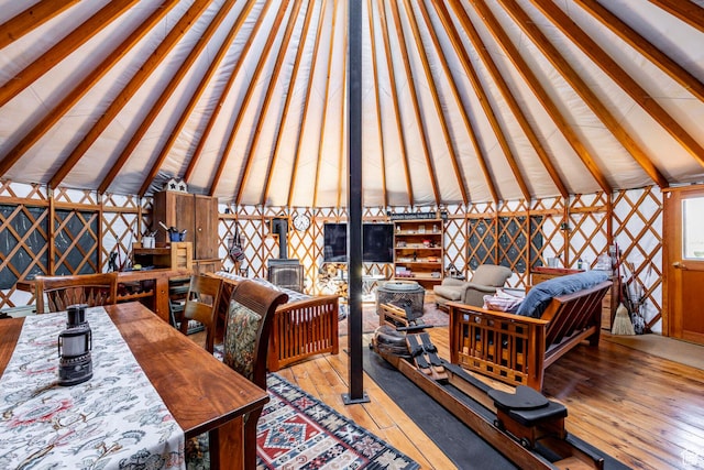 10454 E Forest Creek Rd, Kamas, UT 84036 - interior space featuring a wood stove, vaulted ceiling, and hardwood / wood-style flooring