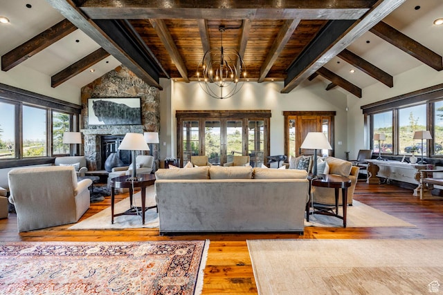 10454 E Forest Creek Rd, Kamas, UT 84036 - living room featuring wood-type flooring, high vaulted ceiling, plenty of natural light, and a fireplace