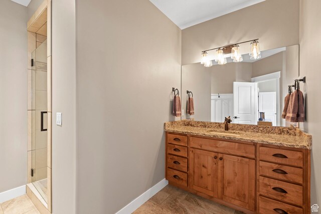 84 W 2100 N, Kamas, UT 84036 - bathroom with a stall shower, vanity, baseboards, and tile patterned floors