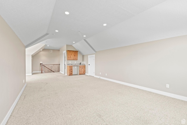 84 W 2100 N, Kamas, UT 84036 - additional living space with a textured ceiling, recessed lighting, light carpet, baseboards, and vaulted ceiling