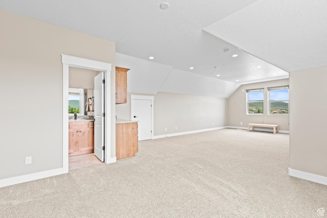 84 W 2100 N, Kamas, UT 84036 - interior space with light carpet, recessed lighting, baseboards, and lofted ceiling