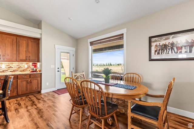 84 W 2100 N, Kamas, UT 84036 - dining space featuring lofted ceiling, light wood-style flooring, and baseboards