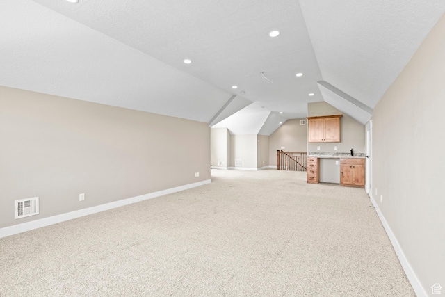 84 W 2100 N, Kamas, UT 84036 - additional living space with visible vents, vaulted ceiling, light carpet, and baseboards