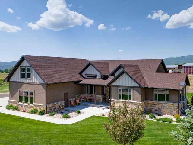 84 W 2100 N, Kamas, UT 84036 - exterior space with stone siding, a mountain view, and a lawn