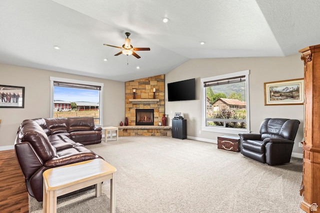 84 W 2100 N, Kamas, UT 84036 - carpeted living area featuring a healthy amount of sunlight, a fireplace, baseboards, and vaulted ceiling