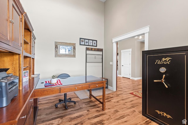 84 W 2100 N, Kamas, UT 84036 - home office featuring a towering ceiling, light wood-style floors, and baseboards